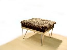 Saxum and Isolyn teamed up at the 'New Designer's Exhibition', Business Design Centre, 2002, to create this footstool, celebrating the contrast between natural and inorganic materials.